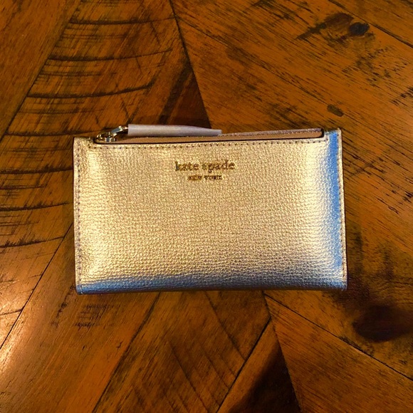 kate spade Handbags - 🆕 NWT Kate Spade Sylvia Slim Gold Bilfold Wallet